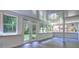 Bright sunroom with multiple windows and doors and wood flooring at 2540 Rocky Springs Dr, Marietta, GA 30062