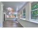 Bright sunroom with multiple windows and doors with wood flooring at 2540 Rocky Springs Dr, Marietta, GA 30062