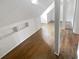 Spacious attic with natural light, built-in shelves, hardwood floors, and ample room at 4023 Oak Crest Dr, Tucker, GA 30084