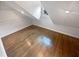 Bright attic featuring hardwood floors, natural light, and a minimalist design at 4023 Oak Crest Dr, Tucker, GA 30084