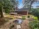 Beautiful backyard with pond, patio, and lush landscaping, creating a serene outdoor retreat at 4023 Oak Crest Dr, Tucker, GA 30084