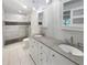 Modern bathroom featuring double vanity, granite countertops, tiled floors, and a walk-in glass shower at 4023 Oak Crest Dr, Tucker, GA 30084