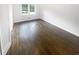 Clean bedroom featuring hardwood floors and a double door closet at 4023 Oak Crest Dr, Tucker, GA 30084