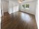 Light-filled bedroom with hardwood floors, large windows, closet space and neutral decor at 4023 Oak Crest Dr, Tucker, GA 30084