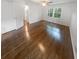 Relaxing bedroom features hardwood floors, a ceiling fan, and a picturesque view at 4023 Oak Crest Dr, Tucker, GA 30084