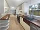 Galley kitchen featuring sleek stainless steel appliances, custom cabinetry, and wood countertops at 4023 Oak Crest Dr, Tucker, GA 30084