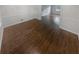 Bright living room boasts pristine white walls, wood flooring, and large window for ample natural light at 4023 Oak Crest Dr, Tucker, GA 30084