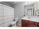 Bathroom with a shower/tub combo and a vanity featuring sleek, updated finishes at 124 Freedom Dr, Acworth, GA 30102