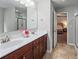 Bathroom featuring double sinks, updated vanity, with a bedroom view at 124 Freedom Dr, Acworth, GA 30102