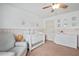 Bedroom with soothing decor and a cozy rocking chair perfect for new parents at 124 Freedom Dr, Acworth, GA 30102