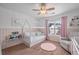 Bright bedroom featuring pink accents, a playful bed frame, and natural lighting at 124 Freedom Dr, Acworth, GA 30102