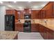 Spacious kitchen featuring stainless steel appliances, granite counters, and ample cabinet storage at 124 Freedom Dr, Acworth, GA 30102