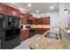 Kitchen featuring stainless steel appliances, granite countertops, and abundant cabinet storage at 124 Freedom Dr, Acworth, GA 30102