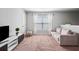 Spacious living room with natural light and a plush couch perfect for relaxation at 124 Freedom Dr, Acworth, GA 30102