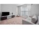 Cozy living room with comfortable seating and a large window for natural light at 124 Freedom Dr, Acworth, GA 30102