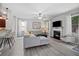 Comfortable living room with a fireplace, modern furniture, and a seamless flow to the kitchen at 124 Freedom Dr, Acworth, GA 30102