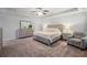 Spacious main bedroom featuring a king bed, sitting area, and ample closet space at 124 Freedom Dr, Acworth, GA 30102