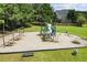 Community playground featuring slides, climbing structures, and a swing set at 124 Freedom Dr, Acworth, GA 30102