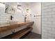 Modern bathroom featuring a wood countertop with vessel sinks and subway tile walls at 1621 Northlake Springs Ct, Decatur, GA 30033