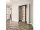 This bedroom has wood flooring, and an open closet with built-in shelves at 1621 Northlake Springs Ct, Decatur, GA 30033