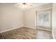 This cozy bedroom has lots of natural light and wood flooring at 1621 Northlake Springs Ct, Decatur, GA 30033
