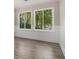 Bedroom featuring hardwood floors, large windows, and natural light at 1621 Northlake Springs Ct, Decatur, GA 30033