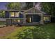The charming home features a covered front porch and manicured lawn at 1621 Northlake Springs Ct, Decatur, GA 30033