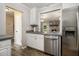 Kitchen featuring stainless steel appliances and granite counter-tops with views to living room at 1621 Northlake Springs Ct, Decatur, GA 30033