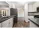 Kitchen featuring stainless steel appliances and granite counter-tops with views to dining area at 1621 Northlake Springs Ct, Decatur, GA 30033