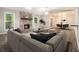 Spacious living room with a stone fireplace, hardwood floors, and natural light, adjacent to dining area at 1621 Northlake Springs Ct, Decatur, GA 30033