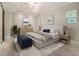 Serene main bedroom features a tray ceiling, ample natural light, and elegant decor at 1621 Northlake Springs Ct, Decatur, GA 30033