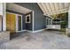 Inviting porch with stone floor and white swing at 1621 Northlake Springs Ct, Decatur, GA 30033