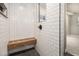Stylish bathroom with a subway tile shower, a built-in wooden bench, and stone floors at 1621 Northlake Springs Ct, Decatur, GA 30033