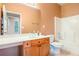 Bathroom featuring a large vanity, mirror, and separate tub-shower combo for convenience at 1883 Jameson Cir, Lawrenceville, GA 30043