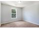 Bedroom featuring neutral walls and plush carpet, creating a cozy retreat at 1883 Jameson Cir, Lawrenceville, GA 30043