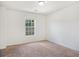 Bedroom featuring neutral walls and plush carpet, creating a cozy retreat at 1883 Jameson Cir, Lawrenceville, GA 30043
