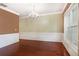 Elegant dining room with hardwood floors, wainscoting, and a stylish chandelier at 1883 Jameson Cir, Lawrenceville, GA 30043