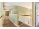 Upstairs hallway showcasing carpet and an open railing overlooking the stairwell at 1883 Jameson Cir, Lawrenceville, GA 30043