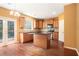 Eat-in kitchen features granite countertops, an island, wood cabinets, and deck access at 1883 Jameson Cir, Lawrenceville, GA 30043