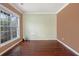 Sunny living room features hardwood floors, large windows, and neutral wall colors at 1883 Jameson Cir, Lawrenceville, GA 30043
