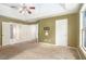 Spacious main bedroom with tray ceiling, fan, and multiple closets for ample storage at 1883 Jameson Cir, Lawrenceville, GA 30043
