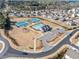 Community aerial view featuring a pool, tennis courts, clubhouse, parking and residential area at 3505 Aqua Point Pl, Cumming, GA 30041