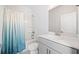 Modern bathroom with shower and tub, featuring updated fixtures and neutral colors at 3505 Aqua Point Pl, Cumming, GA 30041