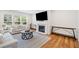 Comfortable living room featuring a fireplace and ample seating creating a cozy atmosphere at 3505 Aqua Point Pl, Cumming, GA 30041