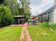 Picturesque backyard featuring a gazebo, patio with furniture, and well-manicured landscaping at 3545 Renaissance Cir, Atlanta, GA 30349