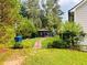 Private backyard oasis with a gazebo, brick pathway, and lush greenery, perfect for outdoor relaxation at 3545 Renaissance Cir, Atlanta, GA 30349