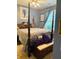 Inviting bedroom with a four-poster bed, bench, and purple accents for a relaxing atmosphere at 3545 Renaissance Cir, Atlanta, GA 30349