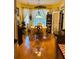 Bright dining room featuring hardwood floors, large window, chandelier and decorative curtains at 3545 Renaissance Cir, Atlanta, GA 30349