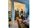 Elegant foyer with hardwood floors, chandelier, and view of dining room and front door at 3545 Renaissance Cir, Atlanta, GA 30349