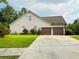 Spacious two-car garage with a large driveway, providing ample parking and convenience at 3545 Renaissance Cir, Atlanta, GA 30349